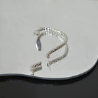 Boucle d'oreille contour au style steampunk
